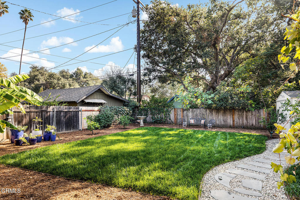 1202 East Lexington Street Pasadena, CA 91104 - Photo 33 of 39 a view of a patio with table and chairs potted plants and large tree