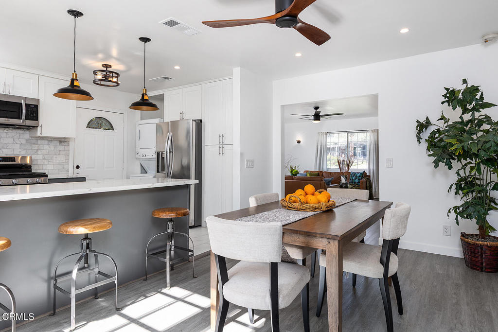 1202 East Lexington Street Pasadena, CA 91104 - Photo 9 of 39 a view of a dining room with furniture and wooden floor