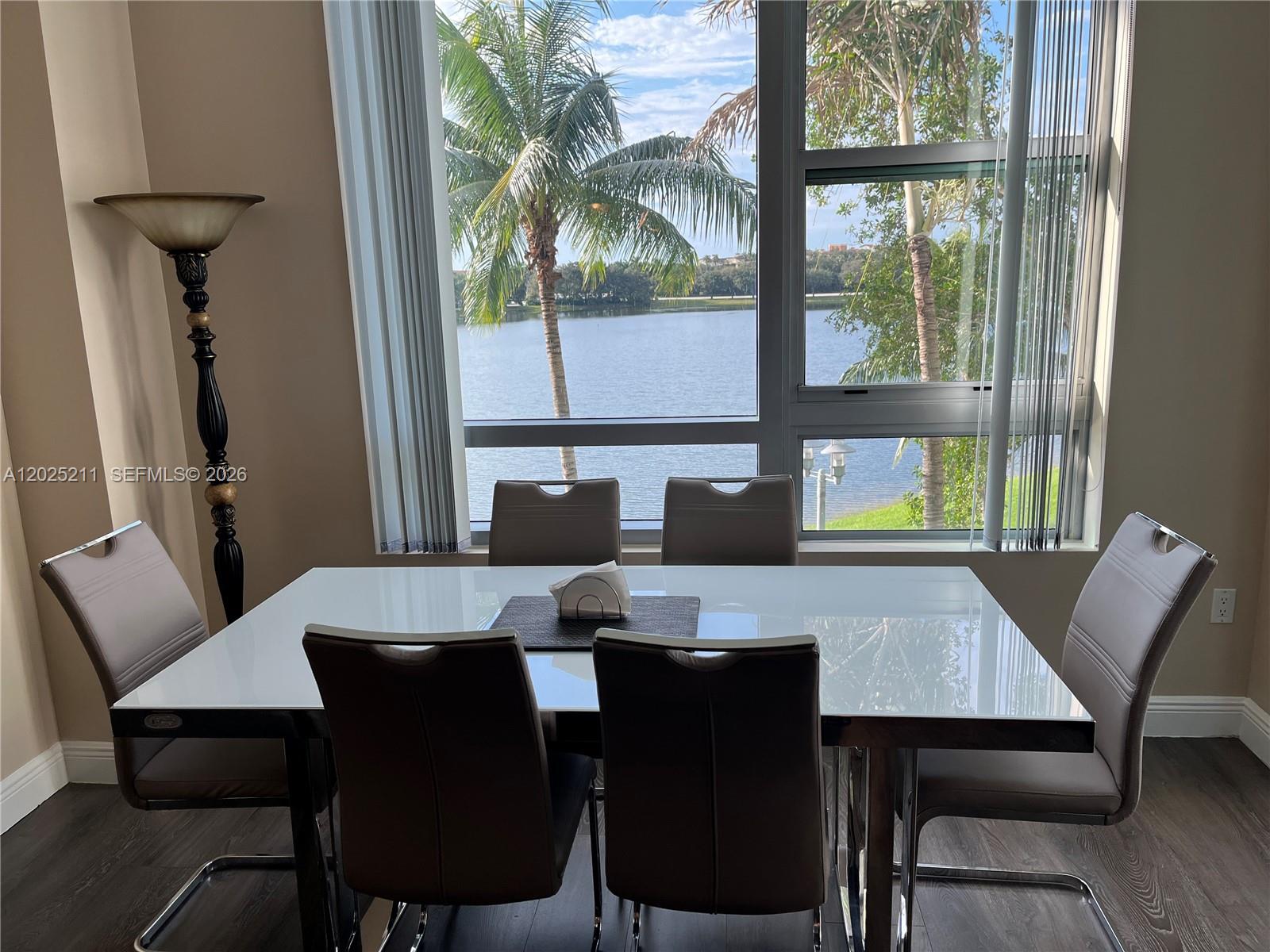 2681 North Flamingo Road, Unit 303S Sunrise, FL 33323 - Photo 4 of 18 a view of a dining room with furniture window and wooden floor
