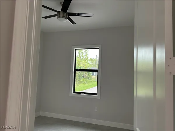 a view of an empty room with a window