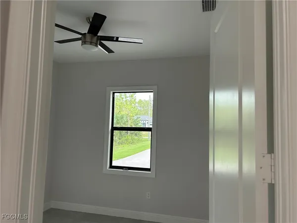 a view of a hallway with a window