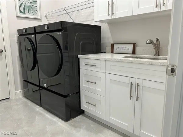 a utility room with washer and dryer