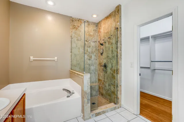 a bathroom with a bathtub and a shower