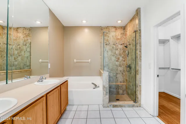 a bathroom with a bathtub shower sink and toilet