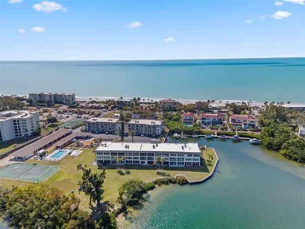 an aerial view of a house with a ocean view