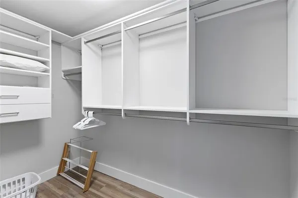 a bed room with a bed and a night stand