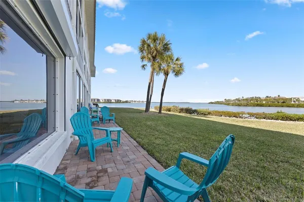 a view of a swimming pool and lounge chairs
