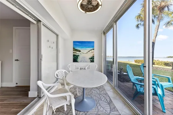 a view of a swimming pool with outdoor seating