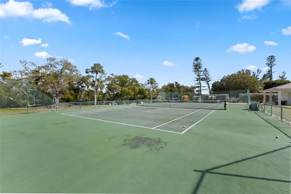 a view of a patio with a table and chairs
