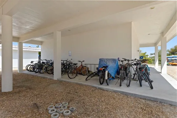 a view of a house with a garden and parking space