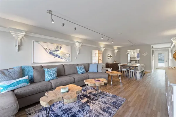 a living room with furniture and a rug