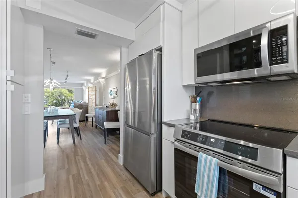 a kitchen with a sink stove and microwave