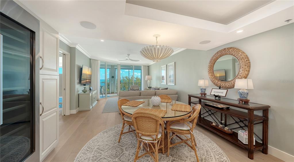 2410 Harbourside Drive, Unit 142 Longboat Key, FL 34228 - Photo 20 of 55 a view of a dining room with furniture and a chandelier