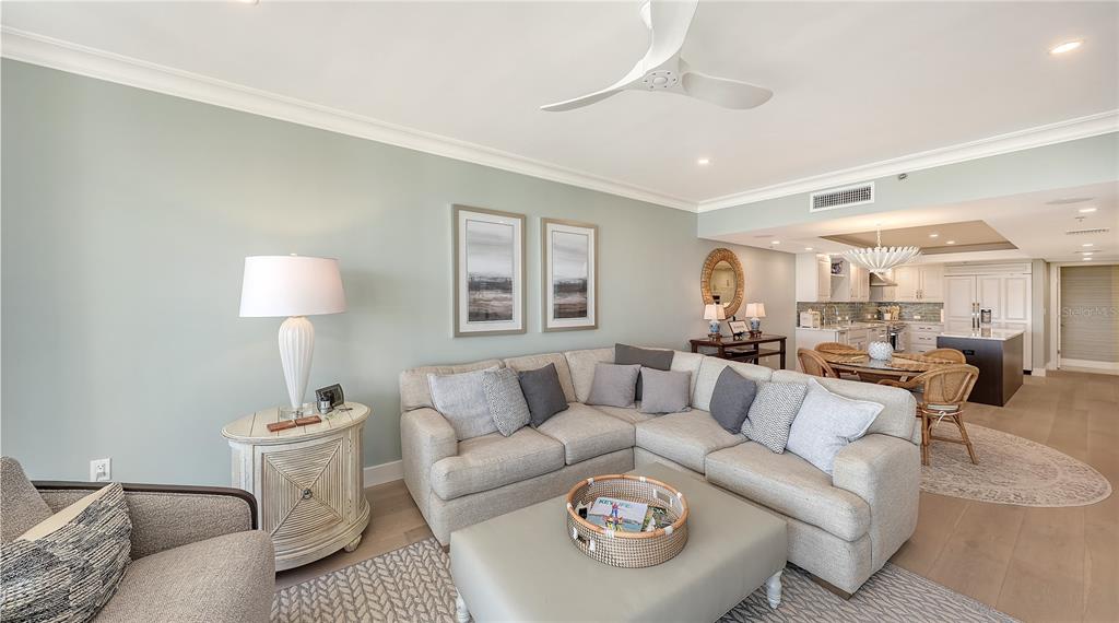 2410 Harbourside Drive, Unit 142 Longboat Key, FL 34228 - Photo 22 of 55 a living room with furniture and a lamp