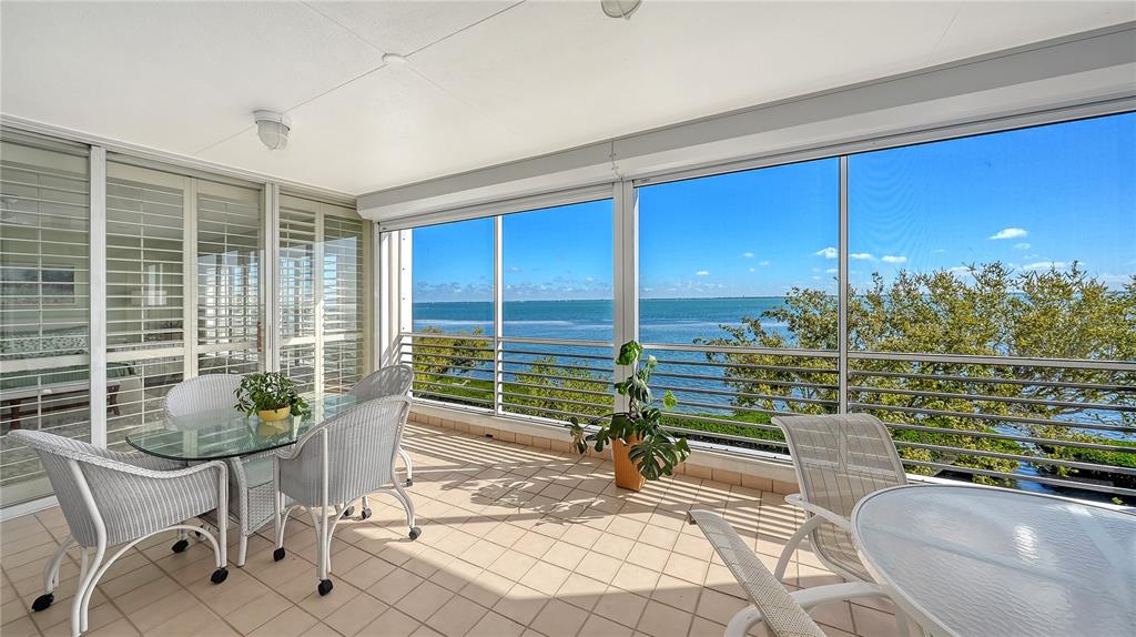 2410 Harbourside Drive, Unit 142 Longboat Key, FL 34228 - Photo 27 of 55 a living room with patio furniture and a potted plant