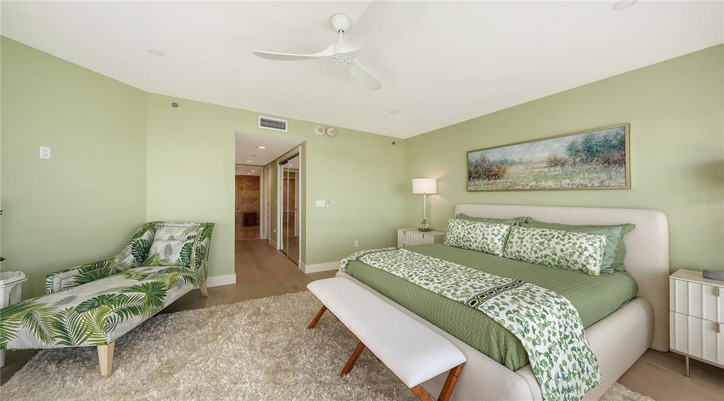 2410 Harbourside Drive, Unit 142 Longboat Key, FL 34228 - Photo 29 of 55 a bedroom with a bed and a couch