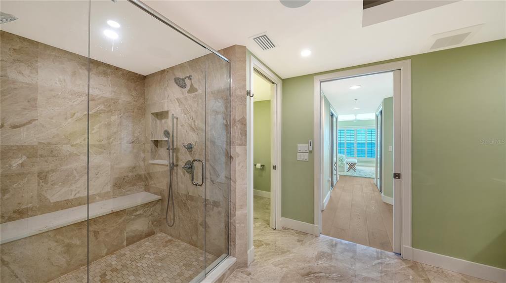 2410 Harbourside Drive, Unit 142 Longboat Key, FL 34228 - Photo 30 of 55 a bathroom with a shower and a glass door