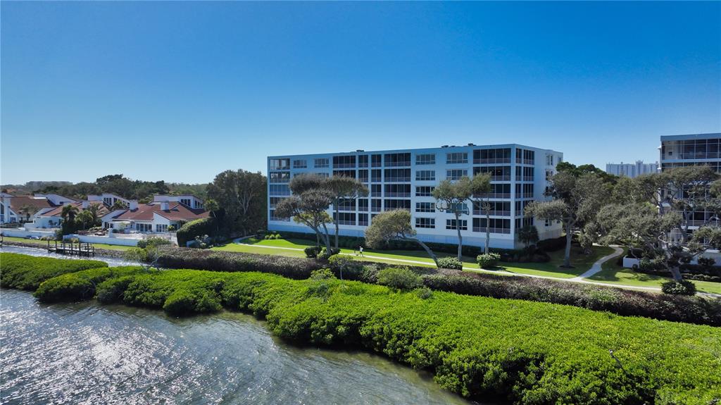 2410 Harbourside Drive, Unit 142 Longboat Key, FL 34228 - Photo 40 of 55 a view of house with a yard and potted plants