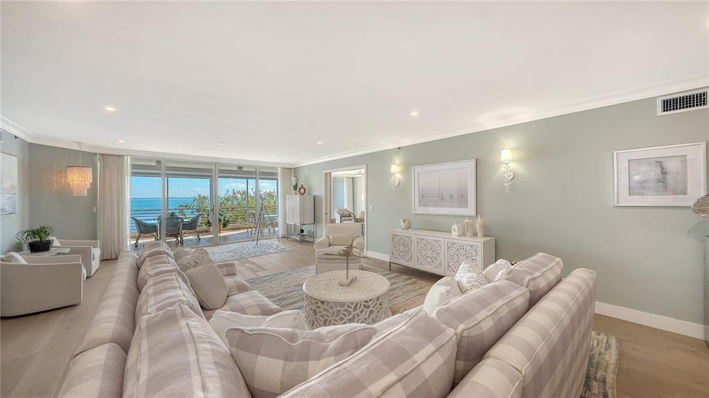 2410 Harbourside Drive, Unit 142 Longboat Key, FL 34228 - Photo 4 of 55 a living room with furniture and a large window