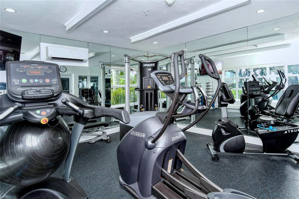 2410 Harbourside Drive, Unit 142 Longboat Key, FL 34228 - Photo 42 of 55 a room with gym equipment