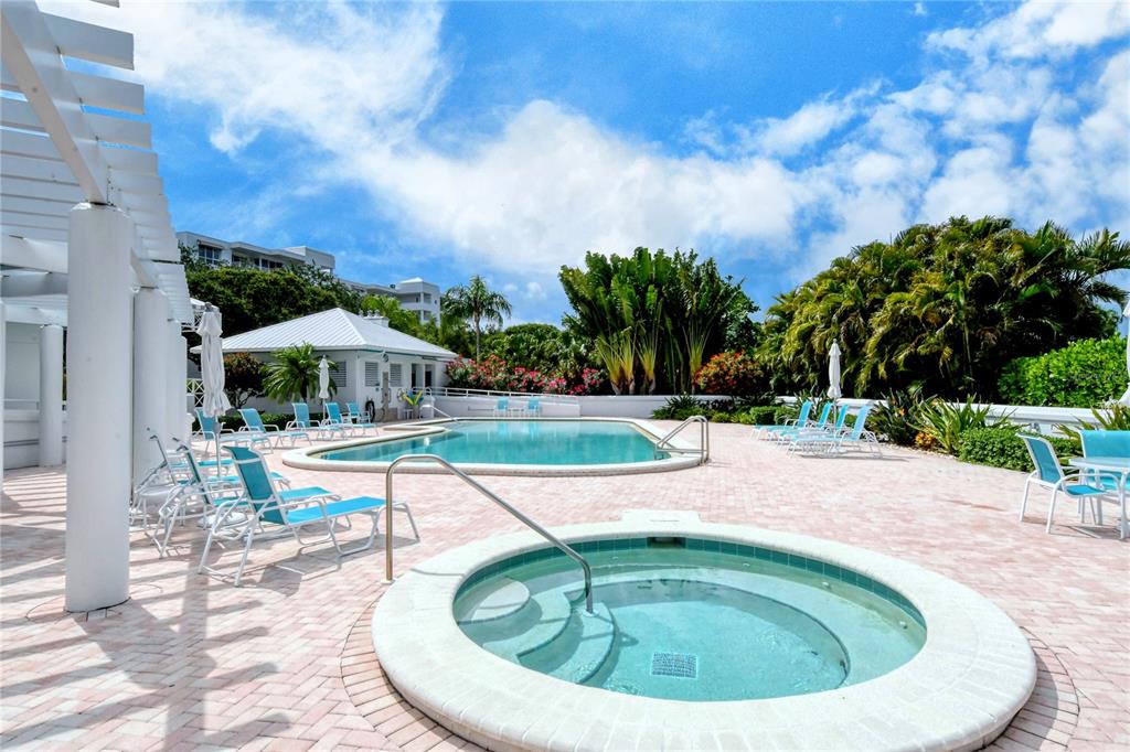 2410 Harbourside Drive, Unit 142 Longboat Key, FL 34228 - Photo 45 of 55 a view of a swimming pool with a patio