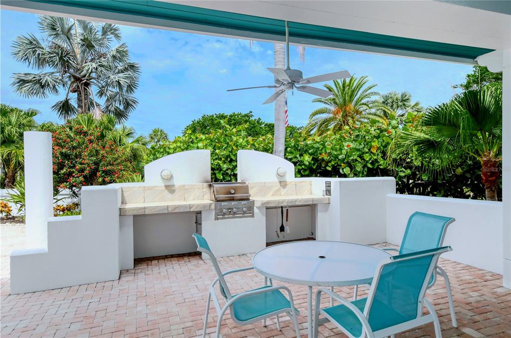 2410 Harbourside Drive, Unit 142 Longboat Key, FL 34228 - Photo 46 of 55 a view of a dining room with a table and chairs