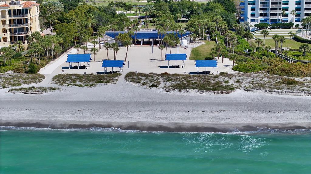 2410 Harbourside Drive, Unit 142 Longboat Key, FL 34228 - Photo 51 of 55 a front view of a house with a yard