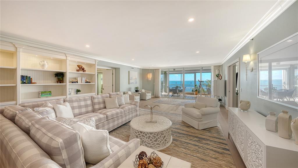 2410 Harbourside Drive, Unit 142 Longboat Key, FL 34228 - Photo 6 of 55 a large living room with furniture or couch and a large window