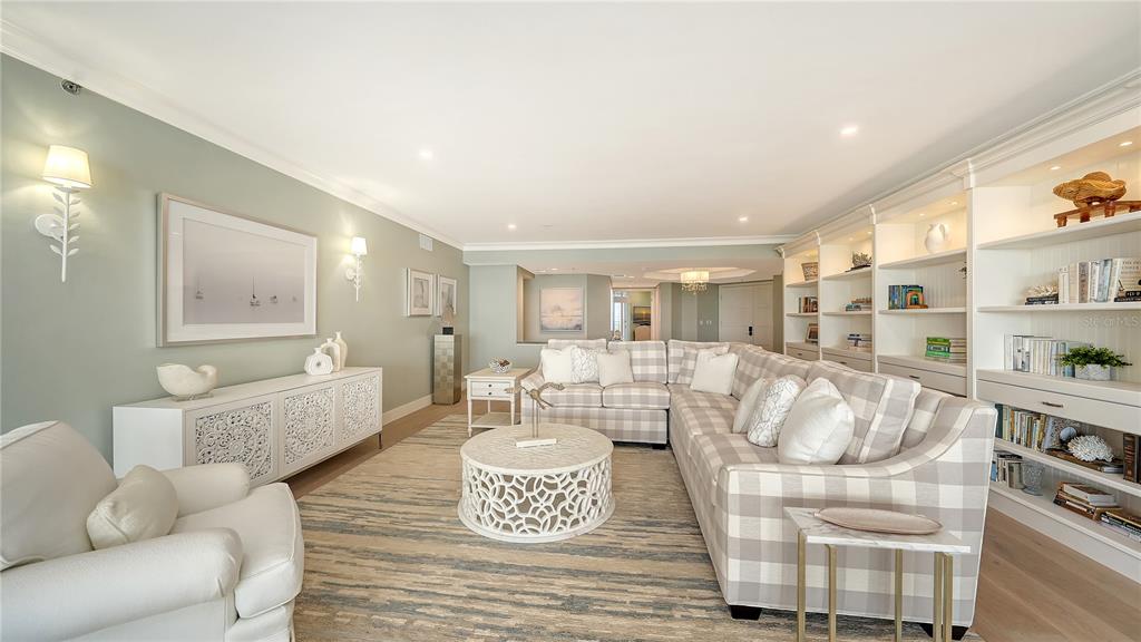 2410 Harbourside Drive, Unit 142 Longboat Key, FL 34228 - Photo 7 of 55 a living room with furniture and a large window