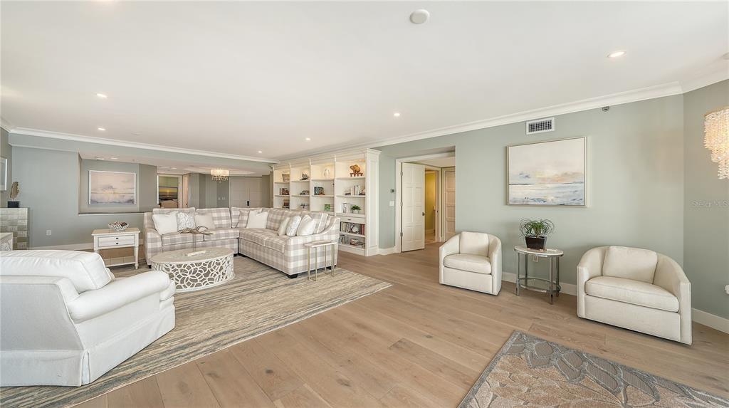 2410 Harbourside Drive, Unit 142 Longboat Key, FL 34228 - Photo 9 of 55 a living room with furniture and white walls