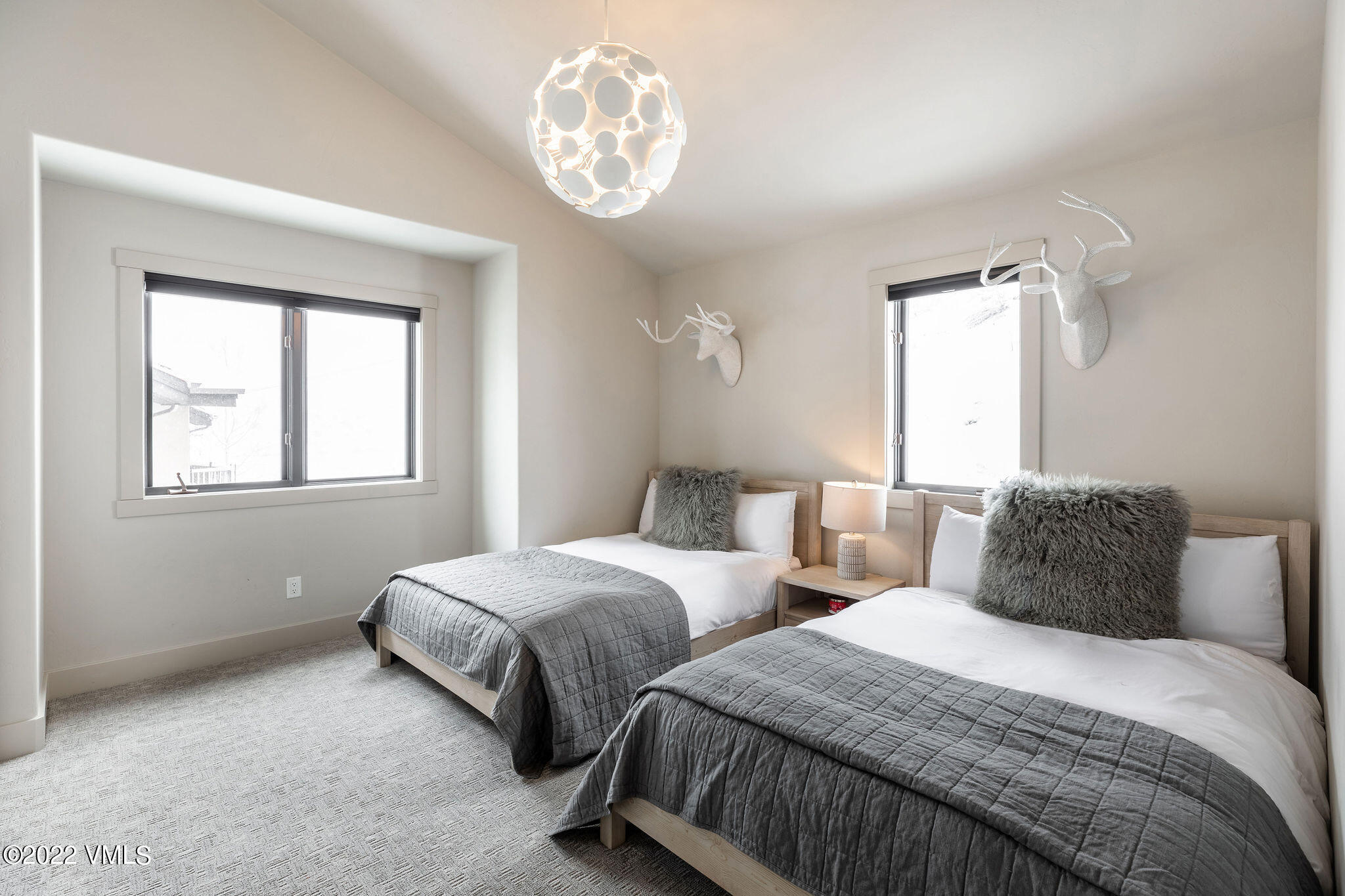 92 Knudson Ranch Road Edwards, CO 81632 - Photo 14 of 21 a bedroom with two beds and a window