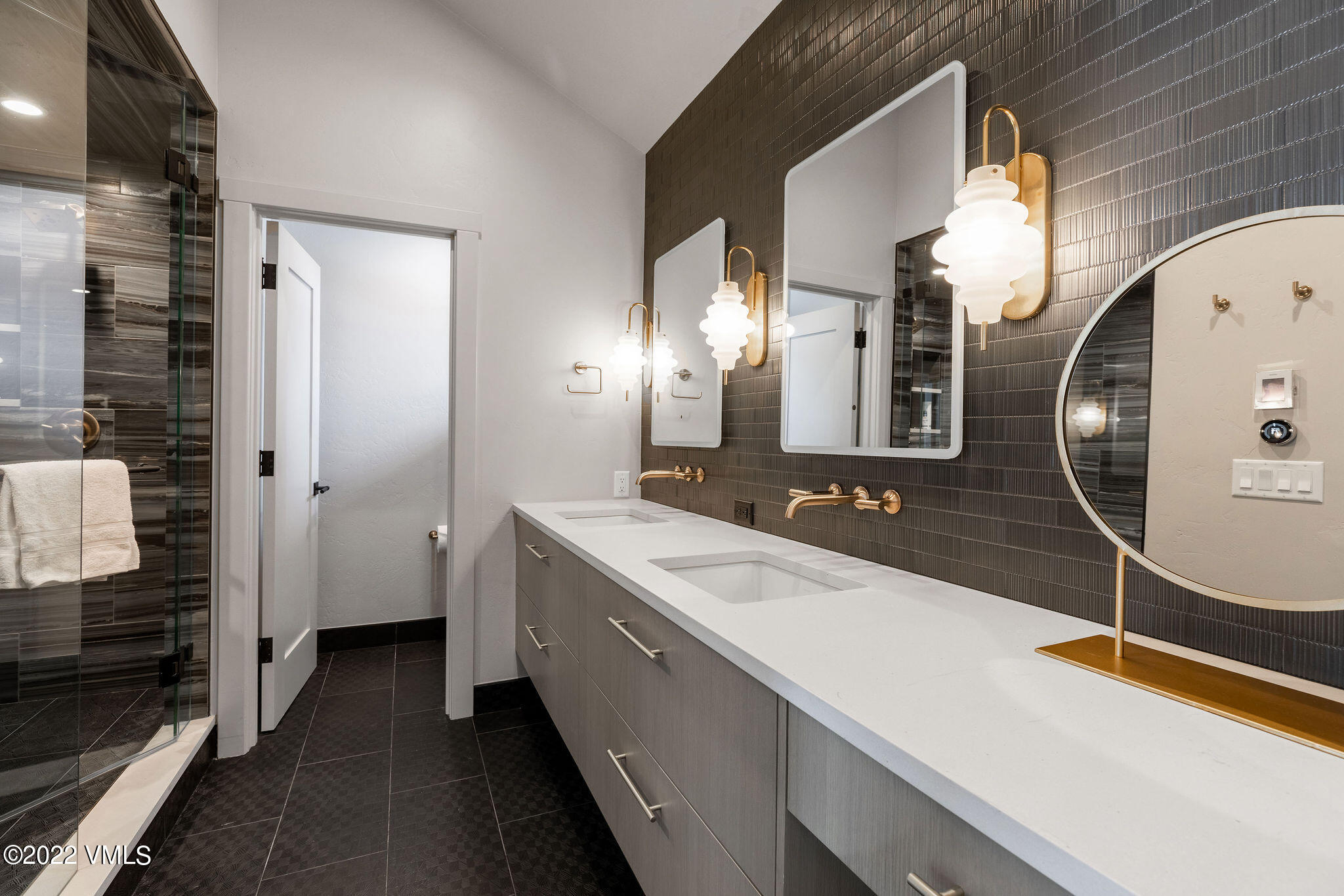 92 Knudson Ranch Road Edwards, CO 81632 - Photo 16 of 21 a bathroom with a double vanity sink and mirror