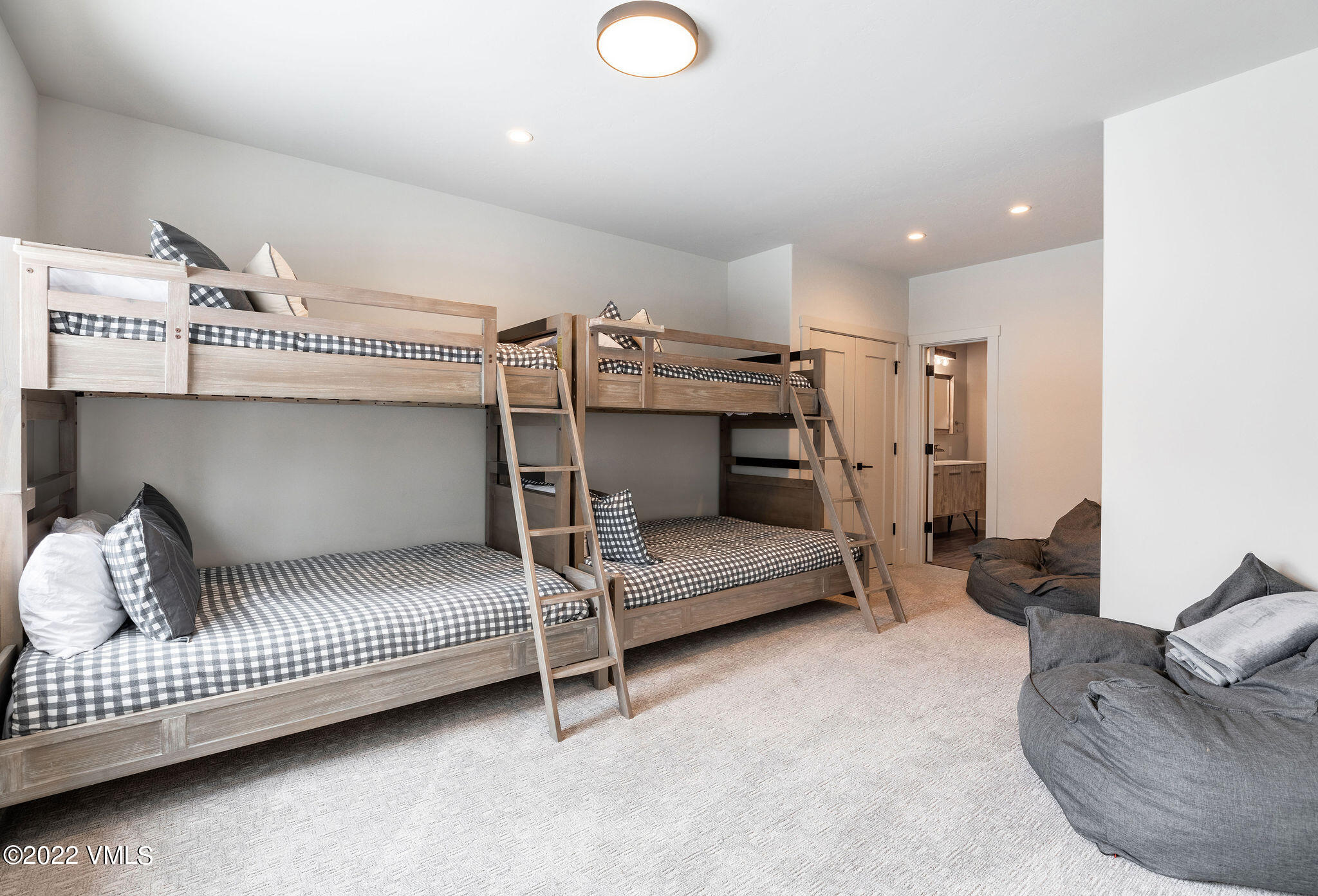 92 Knudson Ranch Road Edwards, CO 81632 - Photo 19 of 21 a bedroom with furniture and a bed