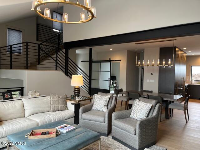 92 Knudson Ranch Road Edwards, CO 81632 - Photo 4 of 21 a living room with furniture and a chandelier