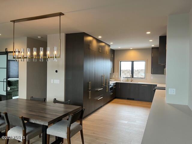 92 Knudson Ranch Road Edwards, CO 81632 - Photo 7 of 21 a kitchen with a table and refrigerator