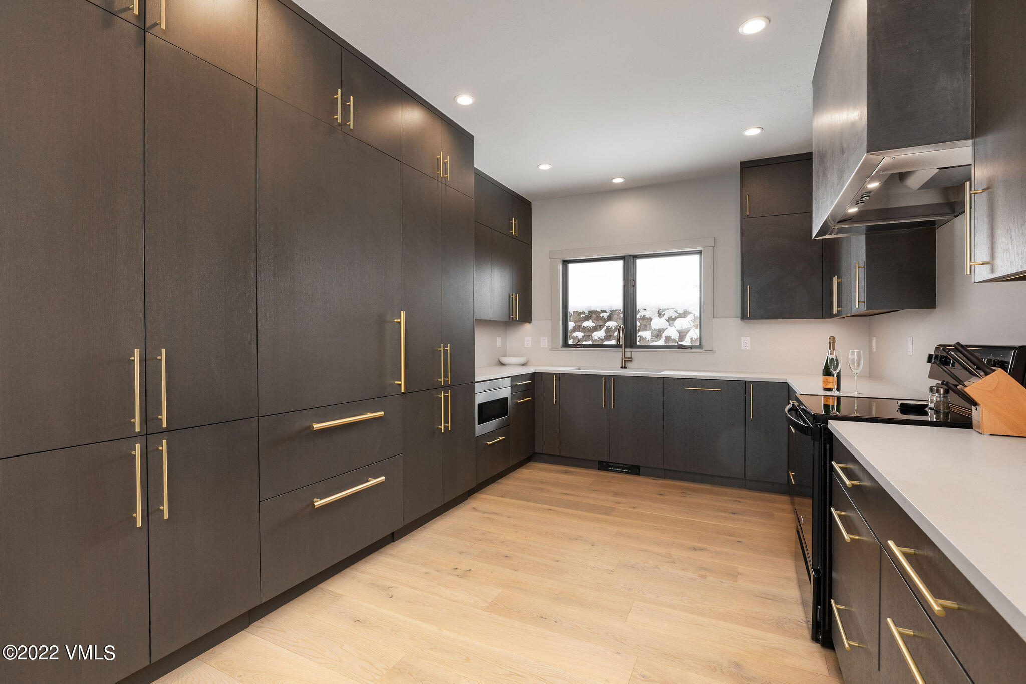 92 Knudson Ranch Road Edwards, CO 81632 - Photo 8 of 21 a kitchen with a refrigerator and a sink