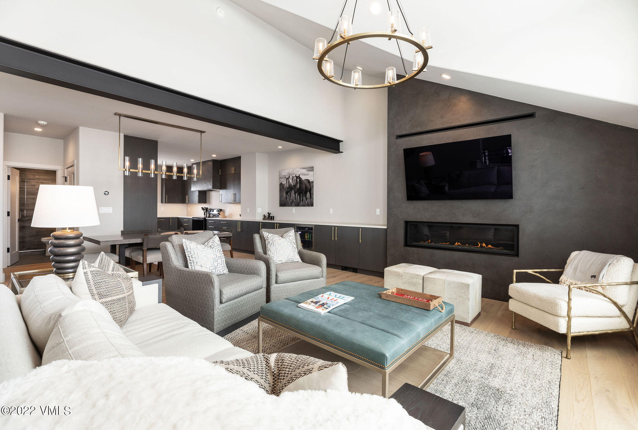 92 Knudson Ranch Road Edwards, CO 81632 - Photo 9 of 21 a living room with furniture a flat screen tv and kitchen view