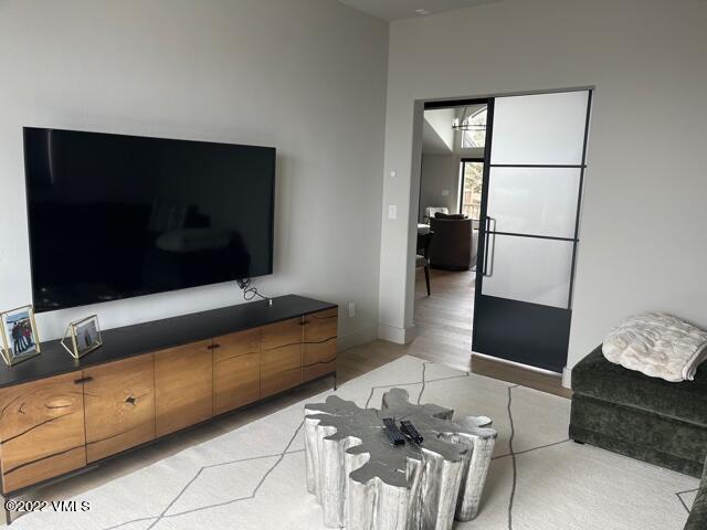 92 Knudson Ranch Road Edwards, CO 81632 - Photo 10 of 21 a living room with furniture and a flat screen tv