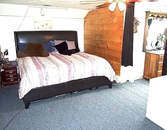 56 Plantation Street Worcester, MA 01604 - Photo 14 of 18 a bedroom with a bed and a flat tv screen on dresser