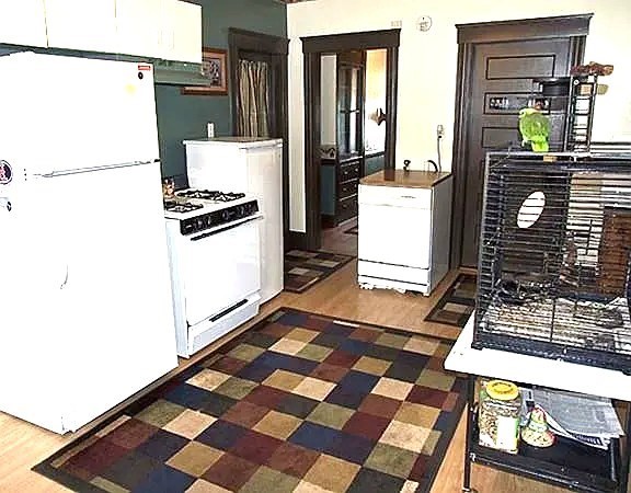 56 Plantation Street Worcester, MA 01604 - Photo 17 of 18 a kitchen with a refrigerator and a stove top oven
