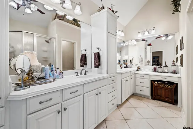 a bathroom with a sink vanity and mirror