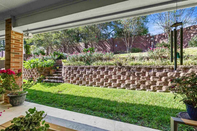 a view of a back yard from a room
