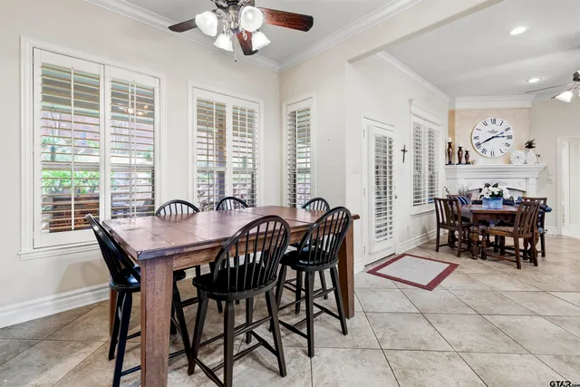 a view of a dining room with furniture and chandelier
