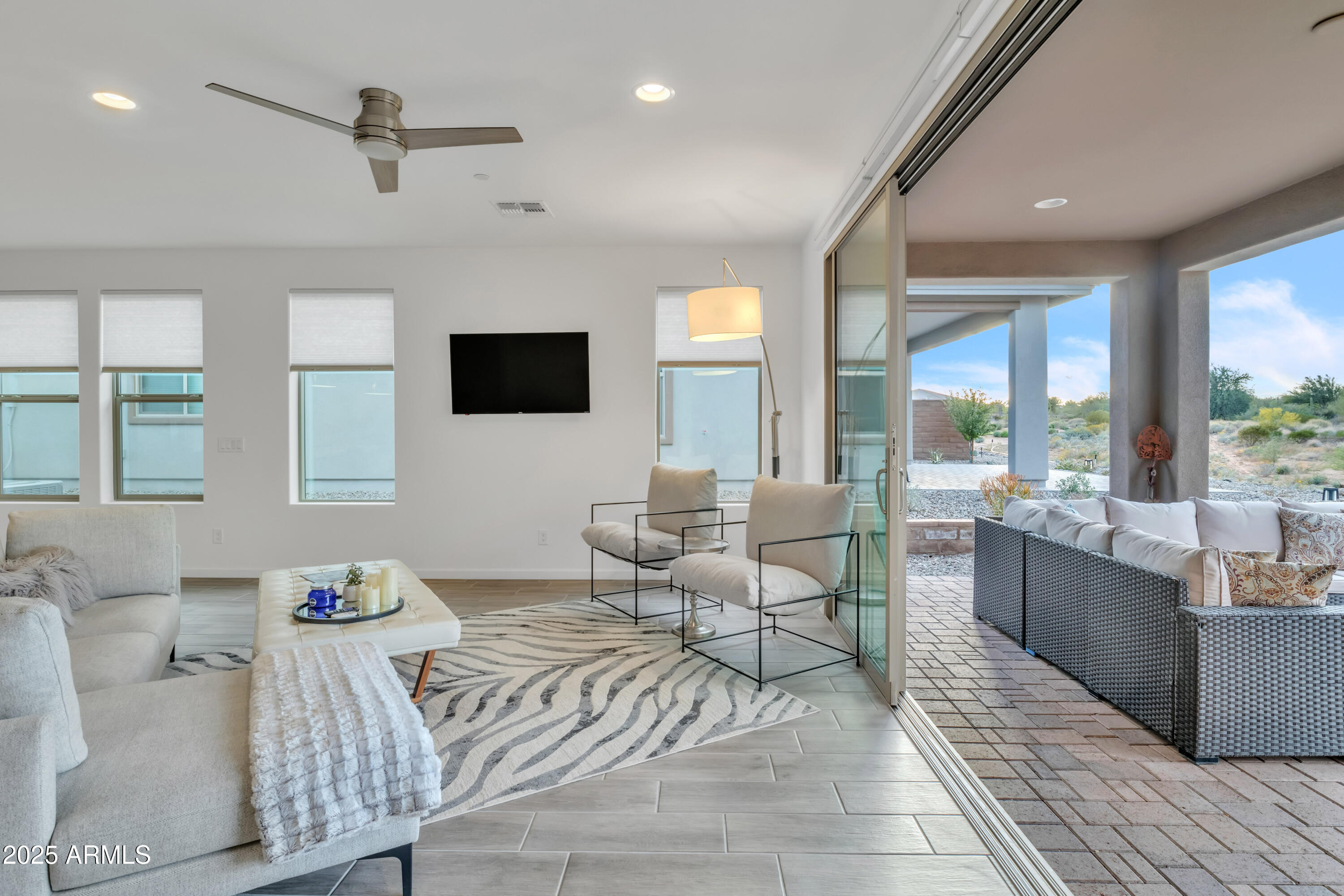 18332 East Spring Valley Court Rio Verde, AZ 85263 - Photo 17 of 41 a living room with furniture and a flat screen tv