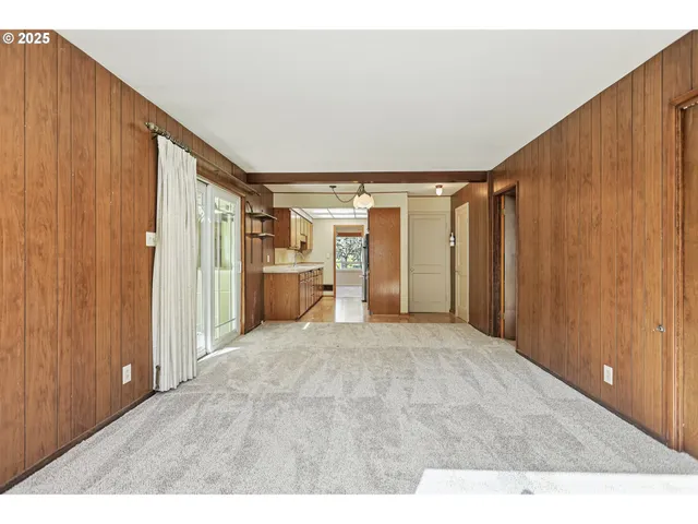 a big room with closet and windows