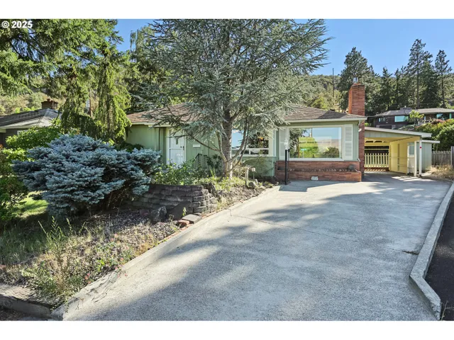 a backyard of a house with yard and outdoor seating