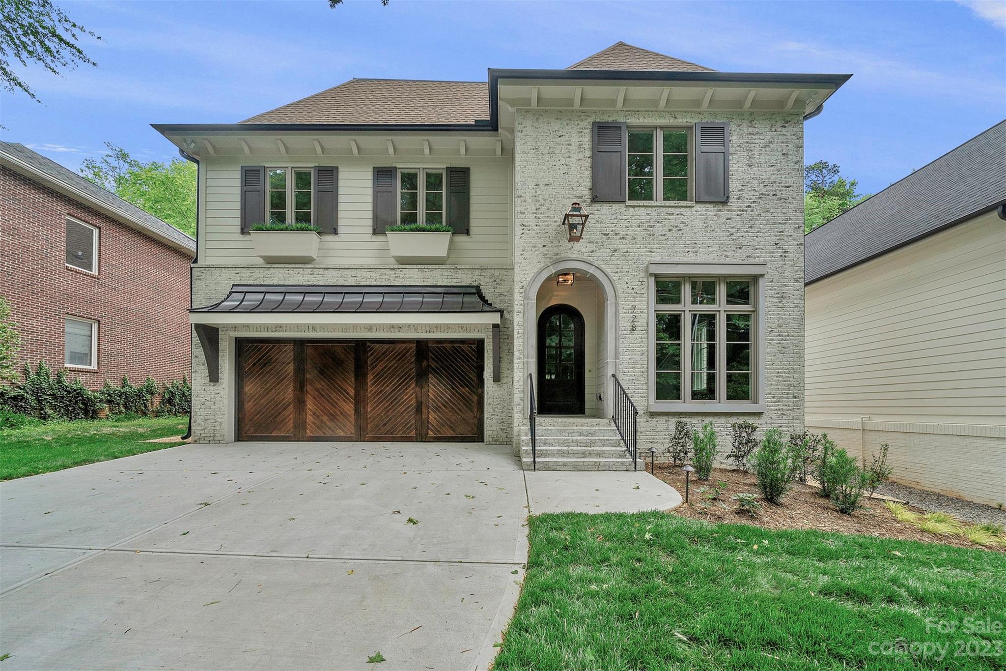 728 Ellsworth Road Charlotte, NC 28211 - Photo 1 of 43 a front view of a house with garden