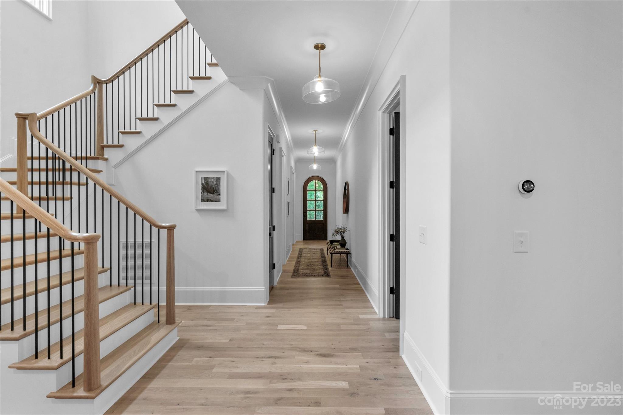 728 Ellsworth Road Charlotte, NC 28211 - Photo 4 of 43 a view of a hallway view with wooden floor and staircase