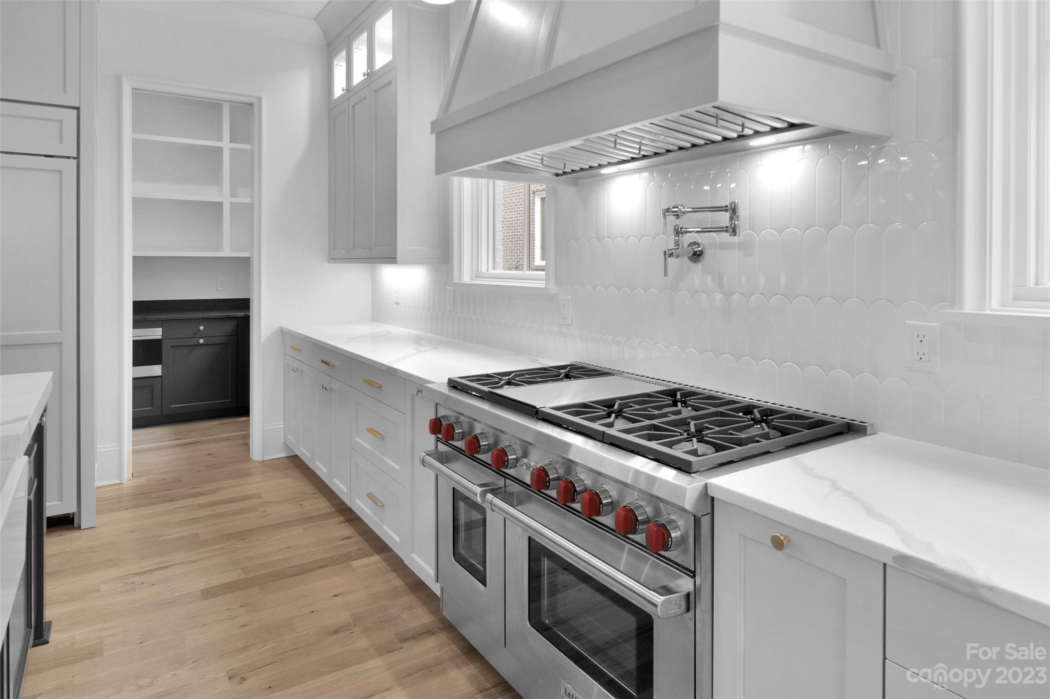 728 Ellsworth Road Charlotte, NC 28211 - Photo 10 of 43 a kitchen with stove and cabinets