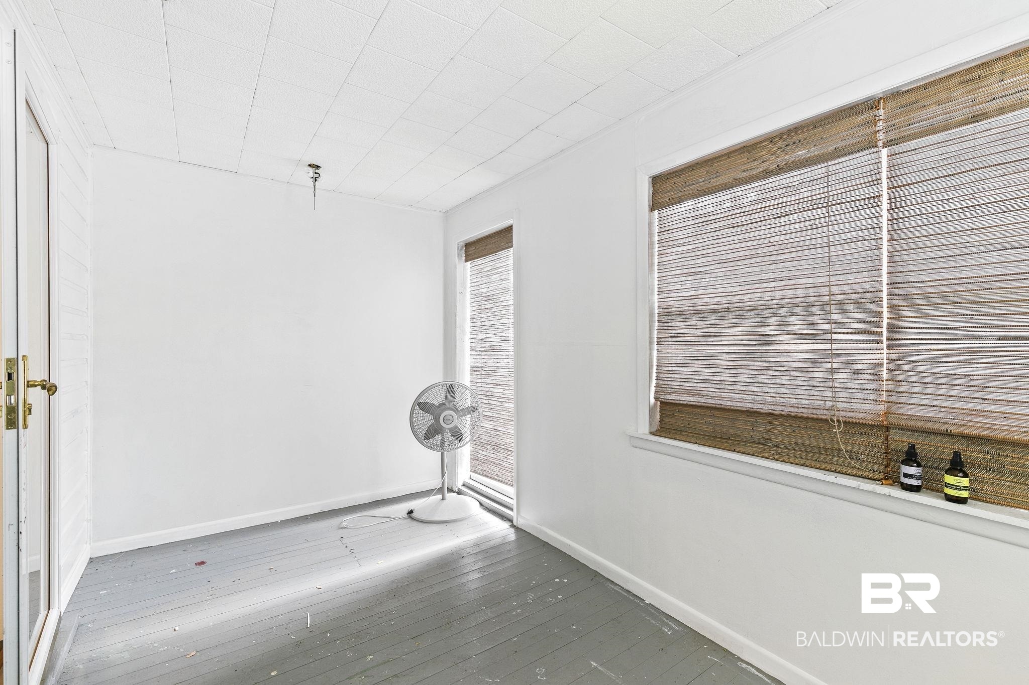 316 West Orchid Avenue Foley, AL 36535 - Photo 23 of 38 Spare room with baseboards and hardwood / wood-style floors